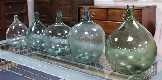 Five green glass carboys